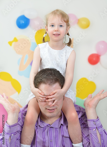 Photo: Father and daughter having fun in playroom Father and daughter having fun in playroom