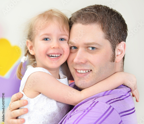 Photo: Father and daughter having fun in playroom Father and daughter having fun in playroom