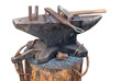 Old anvil with blacksmith tools on the outdoors