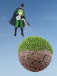 Foto: Eco superhero watering dried planet Eco superhero watering dried planet