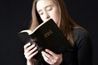 Teen reading Bible