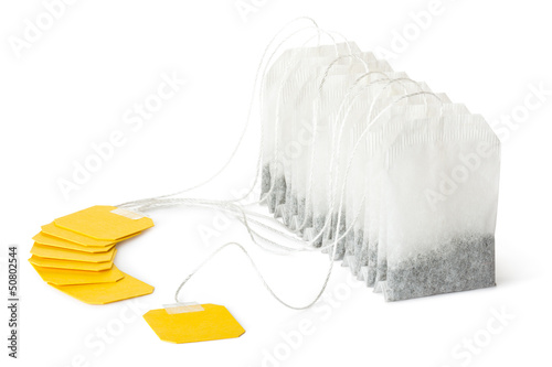 Photo: Row of teabags with yellow label Row of teabags with yellow label