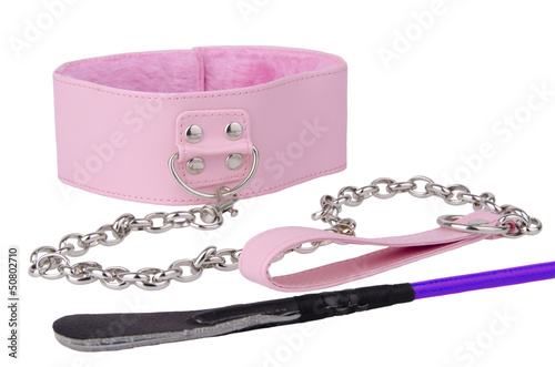 Photo: Pink leather collar and riding crop Pink leather collar and riding crop