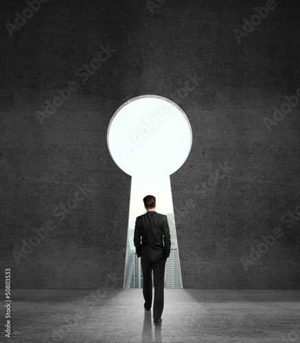 Photo: men walking to opened wall men walking to opened wall