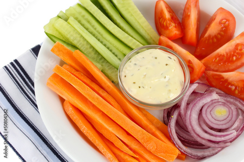 Photo: Assorted raw vegetables sticks in plate close up Assorted raw vegetables sticks in plate close up
