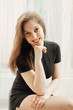 Portrait of young woman on chair