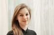 Portrait of positive woman in black
