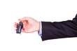 Photo: Male hand holding a car key . New car concept Male hand holding a car key . New car concept