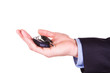 Photo: Male hand holding a car key . New car concept Male hand holding a car key . New car concept