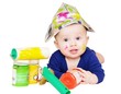 The baby painter with paints age of 6 months