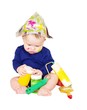The baby painter with paints age of 6 months