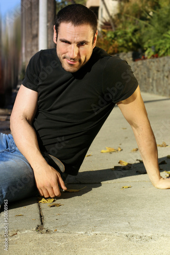 Photo: Casual man on sidewalk Casual man on sidewalk