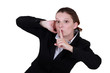Businesswoman shushing