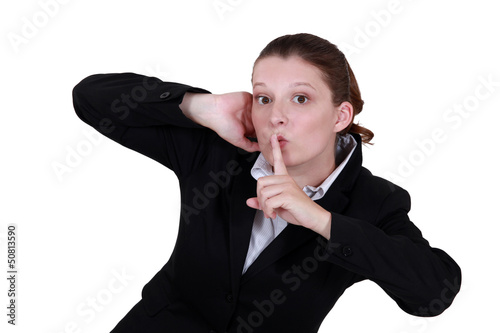 Photo: Businesswoman shushing Businesswoman shushing