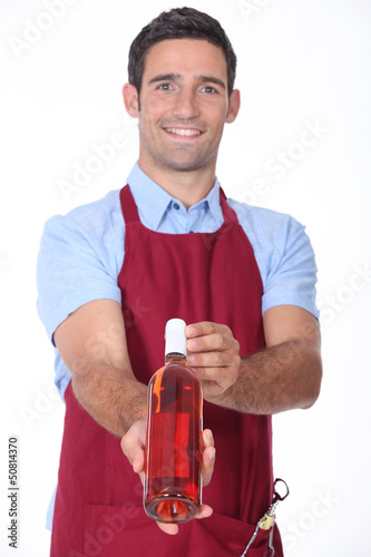 Photo: Waiter offering bottle of wine Waiter offering bottle of wine