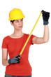 craftswoman holding a meter