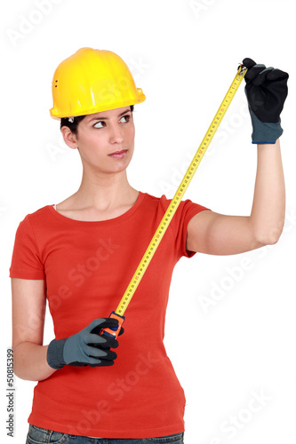 Photo: craftswoman holding a meter craftswoman holding a meter