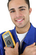Photo: Young electrician smiling on white background Young electrician smiling on white background