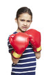 Young girl wearing boxing gloves angry