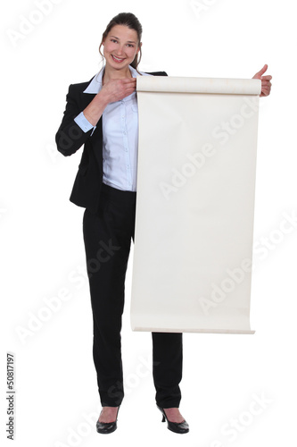Photo: Businesswoman holding a poster Businesswoman holding a poster