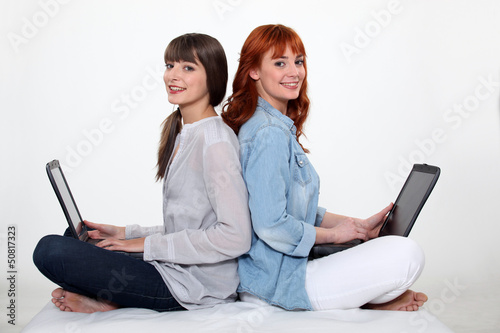 Photo: Two young women with laptops Two young women with laptops