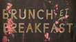 A Grungy French Brunch And Breakfast Sign Outside A Restaurant