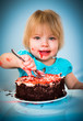 Foto: Little baby girl eating cake Little baby girl eating cake