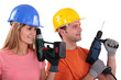 Photo: Tradespeople holding power tools Tradespeople holding power tools