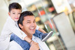 Dad carrying his son at the mall