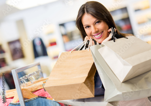Photo: Portrait of shopaholic woman smiling Portrait of shopaholic woman smiling