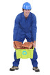 craftsman carrying a box with bricks