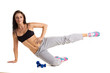 Foto: young sportive woman training with dumbbels young sportive woman training with dumbbels