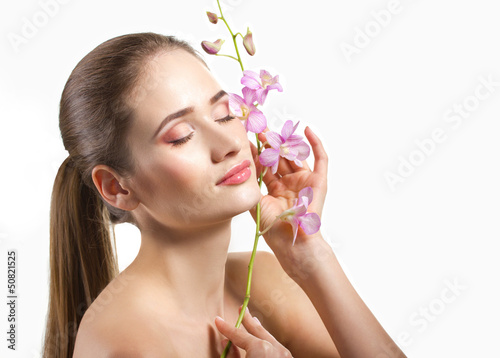 Photo: close-up portrait of a beautiful young woman close-up portrait of a beautiful young woman