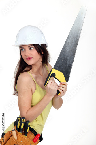Photo: Woman with handsaw Woman with handsaw