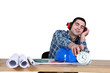 Architect hitting turning alarm clock off