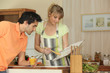 Couple following a recipe