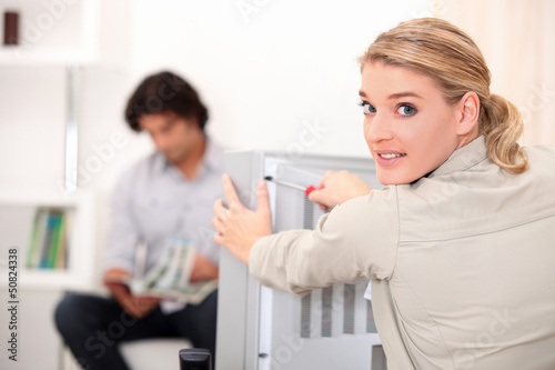 Photo: Female TV repairperson Female TV repairperson