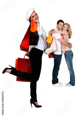 Photo: Three people returning from shopping trip Three people returning from shopping trip