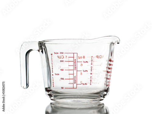 Photo: Measuring mug isolated Measuring mug isolated