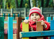 Beautiful happy kid in the red jacket