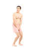 Embarrassed naked man in underwear