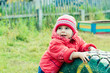 Beautiful happy kid in the red jacket