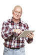 Senior man using tablet computer looking confused