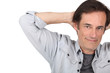 Photo: Man relaxing with arms behind head. Man relaxing with arms behind head.