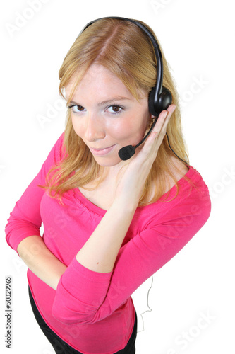 Photo: Woman wearing a telephone headset Woman wearing a telephone headset