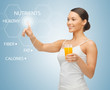 woman with glass of juice and virtual screen