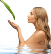 woman with green leaf