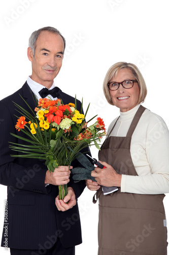 Photo: Portrait of a florist and a man wearing a tuxedo Portrait of a florist and a man wearing a tuxedo