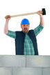 Animated builder holding sledge-hammer