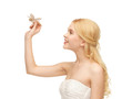 woman with butterfly in hand